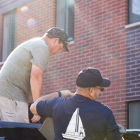 A GVSU Alumnus assist Laker dad by unloading truck